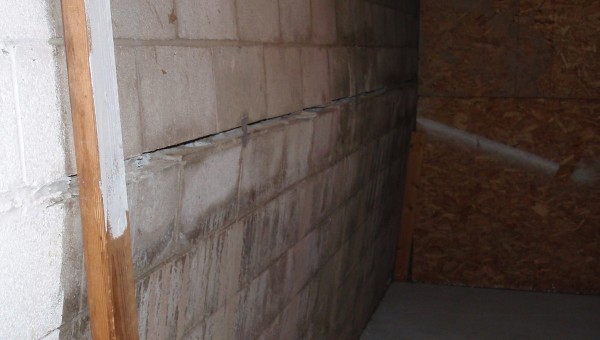 Close up of a bowing wall in a basement