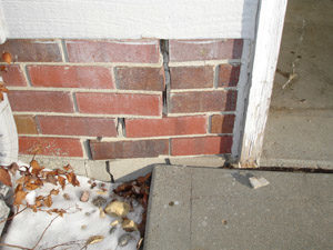 separated brick foundation from street creep