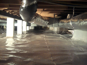 wet, damp crawl space with vapor barrier in iowa